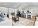 Spacious living area features a large bar open to the kitchen and dining area, creating a bright and airy feel at 121 Ashworth Dr., Little River, SC 29566