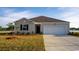 Charming single-story home showcasing a well-manicured lawn and a convenient two-car garage at 1415 Nokota Dr., Conway, SC 29526