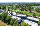Aerial view of condo community nestled on golf course with lush landscaping and city skyline in the distance at 1500 Cenith Dr. # B402, North Myrtle Beach, SC 29582