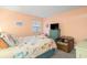 Cozy bedroom featuring beach-themed decor, a TV, and a comfortable bed with colorful linens at 1500 Cenith Dr. # B402, North Myrtle Beach, SC 29582