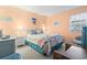 Cozy bedroom with beach-themed decor, complemented by natural light from the window at 1500 Cenith Dr. # B402, North Myrtle Beach, SC 29582
