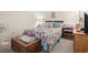 Comfortable bedroom with colorful pineapple themed bedding and decor, side chests for storage at 1500 Cenith Dr. # B402, North Myrtle Beach, SC 29582