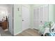 Bright hallway featuring a closet, stylish chair, and easy access to other rooms at 1500 Cenith Dr. # B402, North Myrtle Beach, SC 29582