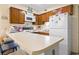 Kitchen island with bar seating complements the cabinets and appliances at 1500 Cenith Dr. # B402, North Myrtle Beach, SC 29582