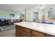 Open floor plan showcases living room and kitchen bar, with neutral color palette and cozy seating at 1500 Cenith Dr. # B402, North Myrtle Beach, SC 29582
