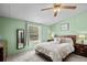 Cozy bedroom featuring a queen-sized bed and calming green walls at 168 Saint Christopher Circle, Pawleys Island, SC 29585