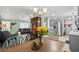 Dining room with views of the kitchen and living room, a dining table with chairs, and lots of light at 168 Saint Christopher Circle, Pawleys Island, SC 29585