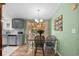 Dining room with views of the kitchen and outdoor area, and lots of natural light at 168 Saint Christopher Circle, Pawleys Island, SC 29585