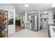 Spacious kitchen with stainless steel refrigerator and view to living area at 168 Saint Christopher Circle, Pawleys Island, SC 29585