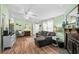 Living room with wood floors, neutral paint, and fireplace at 168 Saint Christopher Circle, Pawleys Island, SC 29585
