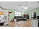 Living room with wood floors, neutral paint, and fireplace at 168 Saint Christopher Circle, Pawleys Island, SC 29585