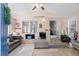 Bright sun room with tiled floors, modern ceiling fan, sofa, and great natural light at 168 Saint Christopher Circle, Pawleys Island, SC 29585