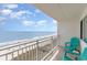 Condo balcony with ocean view, beach access, and patio chairs at 1709 S Ocean Blvd. # 608, North Myrtle Beach, SC 29582