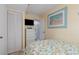 Bedroom featuring closet, TV, dresser, and colorful art at 1709 S Ocean Blvd. # 608, North Myrtle Beach, SC 29582