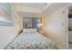 Cozy bedroom features a window with blinds and a lamp on the bedside table at 1709 S Ocean Blvd. # 608, North Myrtle Beach, SC 29582