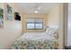 Bedroom with ocean view, TV and coastal style decor at 1709 S Ocean Blvd. # 608, North Myrtle Beach, SC 29582