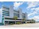 Daytime exterior view of a condo building showcasing its architecture and front entrance at 1709 S Ocean Blvd. # 608, North Myrtle Beach, SC 29582