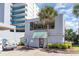Exterior view of office building and palm tree on the premises at 1709 S Ocean Blvd. # 608, North Myrtle Beach, SC 29582
