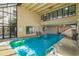 Bright indoor pool area with large windows and doors, complete with shallow and deep end markings at 1709 S Ocean Blvd. # 608, North Myrtle Beach, SC 29582