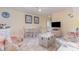 Cozy condo living room with dining area, kitchen access, and television at 1709 S Ocean Blvd. # 608, North Myrtle Beach, SC 29582