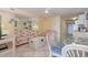 Bright condo living room featuring tiled floor, coastal decor, and dining area at 1709 S Ocean Blvd. # 608, North Myrtle Beach, SC 29582