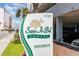 San-A-Bel Towers sign with palm tree and address at 1709 S Ocean Blvd. # 608, North Myrtle Beach, SC 29582