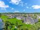 Expansive aerial view of well-maintained homes, lush green lawns, and a serene waterway under a bright blue sky at 178 Kessinger Dr., Surfside Beach, SC 29575