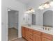 Bright bathroom featuring double sinks, a walk-in closet, and decorative lighting at 178 Kessinger Dr., Surfside Beach, SC 29575