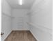 Spacious walk-in closet with ample shelving and neutral carpeting at 178 Kessinger Dr., Surfside Beach, SC 29575
