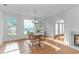 Bright dining room features tile flooring, large windows, and decorative chandelier at 178 Kessinger Dr., Surfside Beach, SC 29575