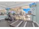 Bright fitness center with modern exercise equipment, large windows, and mounted TVs for entertainment at 178 Kessinger Dr., Surfside Beach, SC 29575