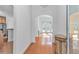 Bright foyer featuring hardwood floors, arched doorways, and views into living spaces at 178 Kessinger Dr., Surfside Beach, SC 29575
