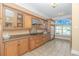 Well-lit kitchen featuring custom cabinetry, stainless steel appliances, and a large window with scenic views at 178 Kessinger Dr., Surfside Beach, SC 29575
