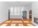 Bright living room features hardwood floors, a fireplace, and arched doorways to other spaces at 178 Kessinger Dr., Surfside Beach, SC 29575