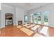 Spacious living room with hardwood floors, fireplace, and large windows with backyard views at 178 Kessinger Dr., Surfside Beach, SC 29575