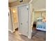 View from hallway into second bedroom and an adjacent bathroom at 180 Rothbury Circle # 116, Myrtle Beach, SC 29572
