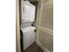 Convenient laundry closet with stacked washer and dryer units, optimizing space and functionality at 180 Rothbury Circle # 116, Myrtle Beach, SC 29572