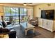 Cozy living area with lake views, modern furniture, and a sliding glass door at 180 Rothbury Circle # 116, Myrtle Beach, SC 29572