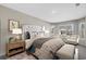 Comfortable primary bedroom with tufted headboard, bedside tables, and a bay window sitting area at 186 Glengrove Lane, Murrells Inlet, SC 29576