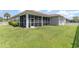 Exterior view of the home's siding, roof, and spacious backyard at 197 Northside Dr., Little River, SC 29566