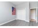 Neutral bedroom featuring plank flooring and a view of a closet at 197 Northside Dr., Little River, SC 29566