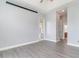 Spacious bedroom featuring gray plank flooring and a ceiling fan at 197 Northside Dr., Little River, SC 29566