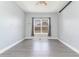 Bedroom featuring gray wood flooring, a ceiling fan, and a window allowing natural light at 197 Northside Dr., Little River, SC 29566