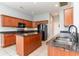 Well-equipped kitchen boasts granite countertops, an island, and stainless steel appliances at 197 Northside Dr., Little River, SC 29566
