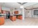 Open kitchen featuring granite countertops, an island, and stainless steel appliances with tile flooring at 197 Northside Dr., Little River, SC 29566