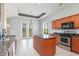 Bright kitchen with granite countertops, stainless steel appliances, and an island with an eat-in counter at 197 Northside Dr., Little River, SC 29566