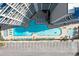 Aerial view of large outdoor swimming pool and parking area at 200 76Th Ave. N # 1009, Myrtle Beach, SC 29572
