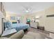 Bright bedroom with a queen-size bed, a ceiling fan, wood-look floors, and a neutral color palette at 200 76Th Ave. N # 1009, Myrtle Beach, SC 29572