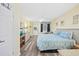 This inviting bedroom is designed with a queen bed, wood look flooring, and plenty of room to relax at 200 76Th Ave. N # 1009, Myrtle Beach, SC 29572