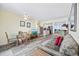 Bright living room featuring a dining area, wood floors, and access to the balcony at 200 76Th Ave. N # 1009, Myrtle Beach, SC 29572